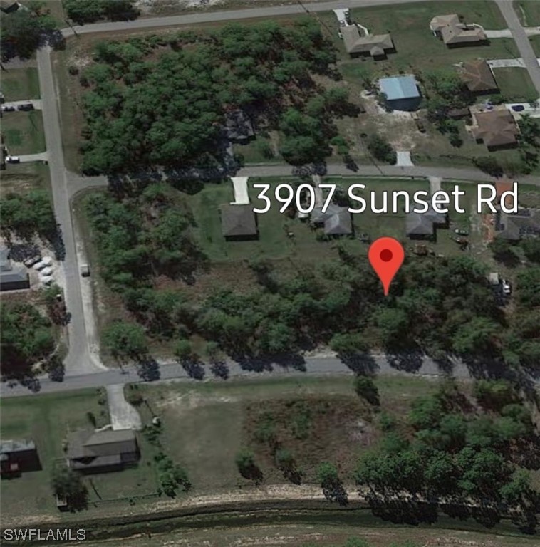 3907 Sunset Road Lehigh Acres, FL 33971 - Photo 3 of 3 a view of a outdoor space