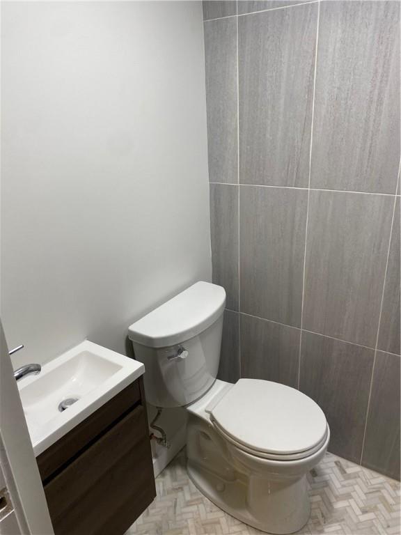 658 Fort Couch Road Pittsburgh, PA 15241 - Photo 14 of 17 a white toilet sitting next to a white sink and vanity