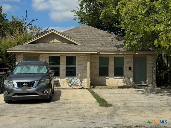 a front view of a house with a sitting space