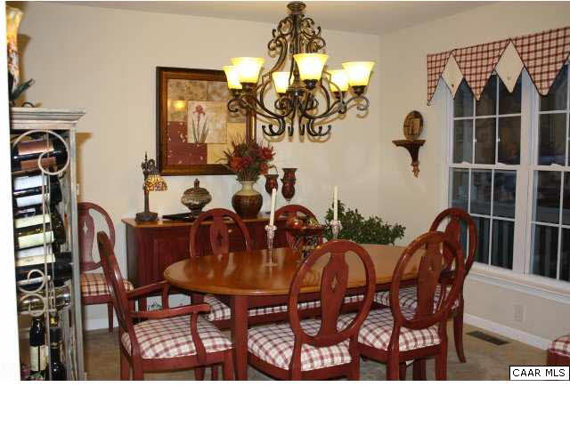 308 Pine Ridge Road Faber, VA 22938 - Photo 6 of 27 a view of a dining room with furniture and chandelier