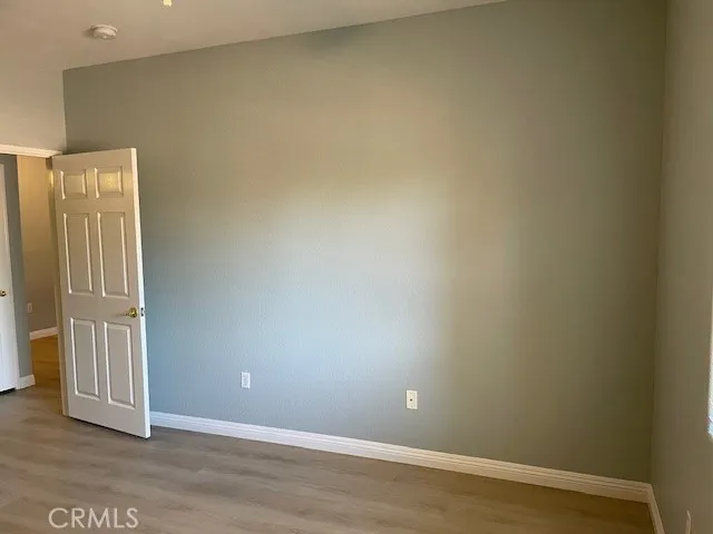 an empty room with wooden floor