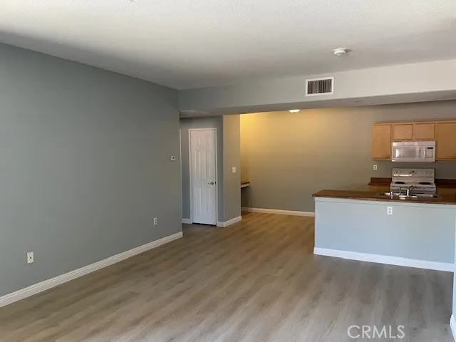 a view of a livingroom with wooden floor