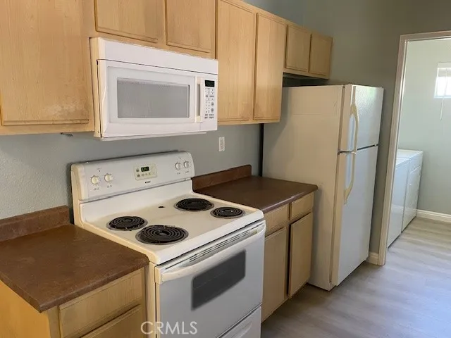 a kitchen with a stove and a refrigerator