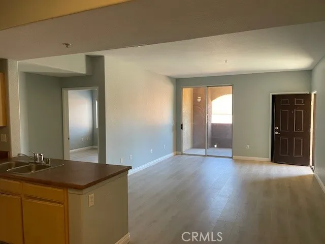 a view of a kitchen cabinets and wooden floor