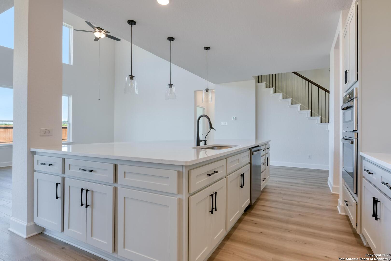 178 Annette Drive Castroville, TX 78009 - Photo 14 of 43 a spacious bathroom with double vanity and mirrors