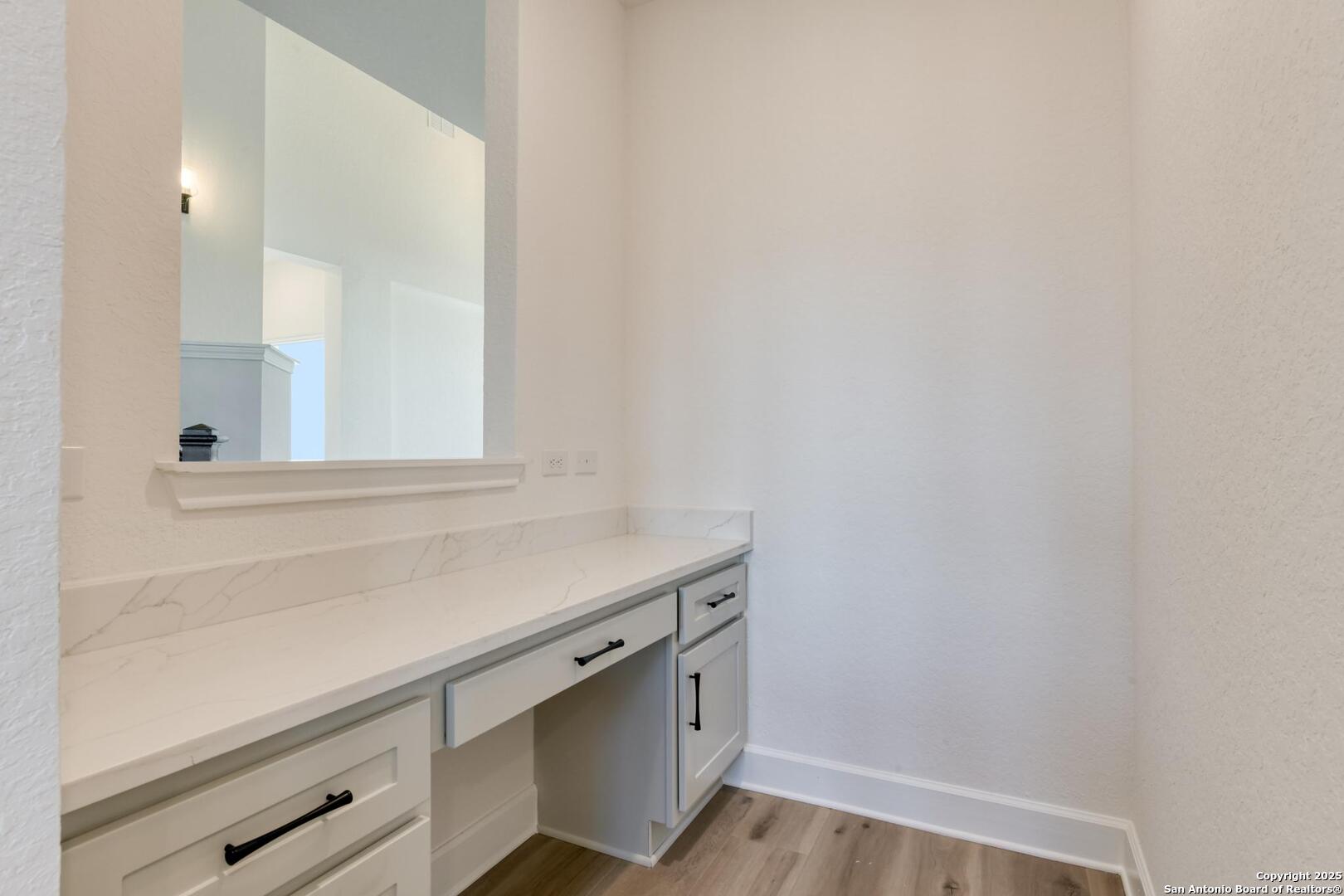 178 Annette Drive Castroville, TX 78009 - Photo 18 of 43 a view of cabinets with wooden floor
