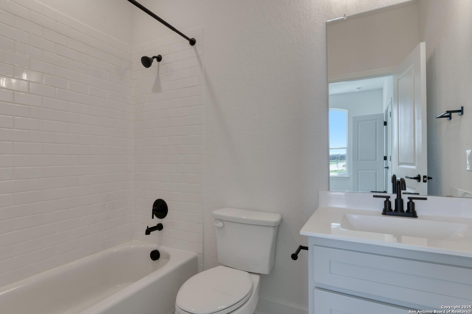 178 Annette Drive Castroville, TX 78009 - Photo 35 of 43 a bathroom with a sink a toilet and a bathtub