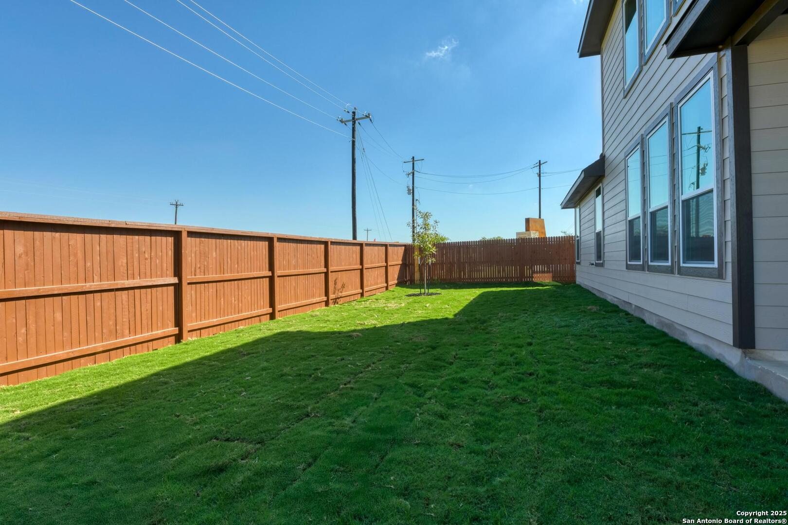 178 Annette Drive Castroville, TX 78009 - Photo 41 of 43 a view of a backyard with potted plants