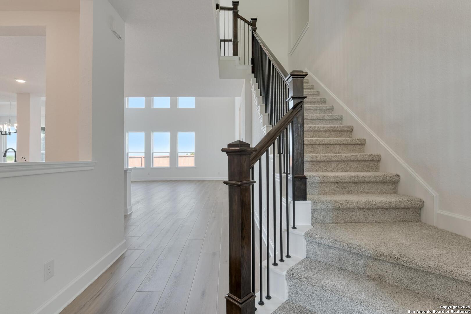 178 Annette Drive Castroville, TX 78009 - Photo 6 of 43 a view of a hallway with wooden floor and entryway
