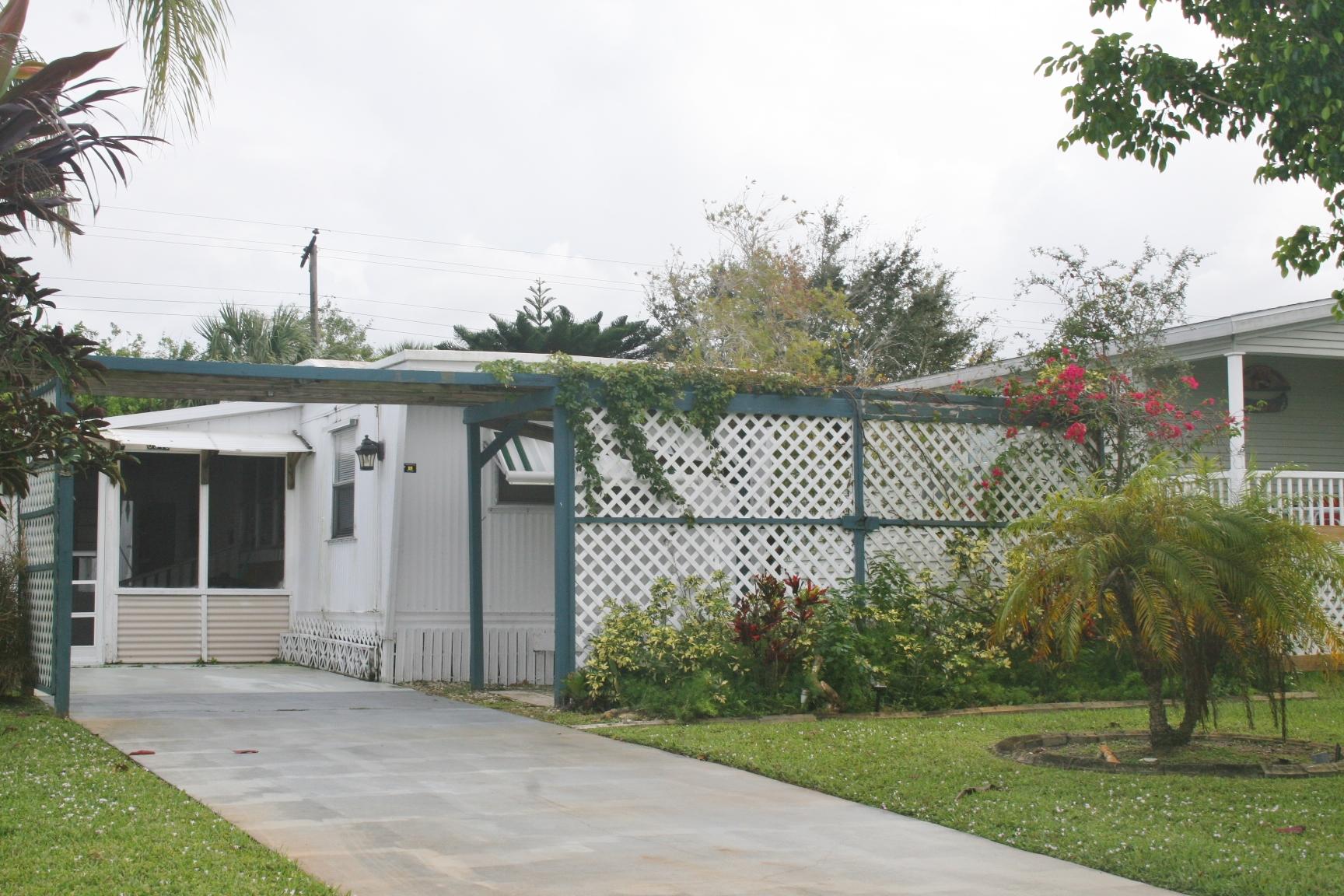 6940 Southeast Ridgeway Terrace Hobe Sound, FL 33455 - Photo 1 of 22 Exterior Front