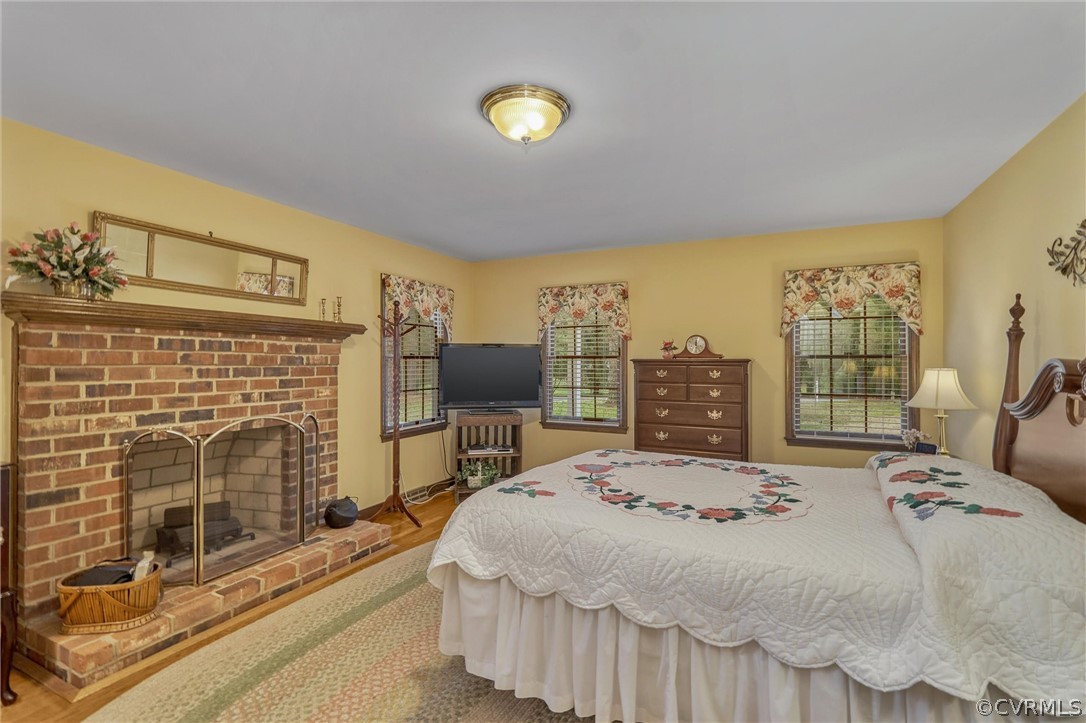 9630 Pasture Hill Road Midlothian, VA 23112 - Photo 14 of 27 Large first floor primary bedroom with wood burning fireplace
