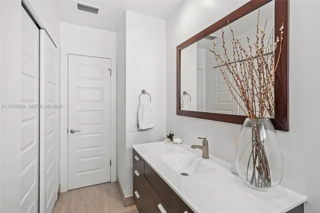 a bathroom with a sink and a mirror