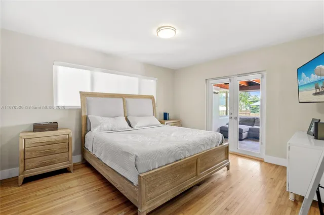 a bedroom with a bed and a table