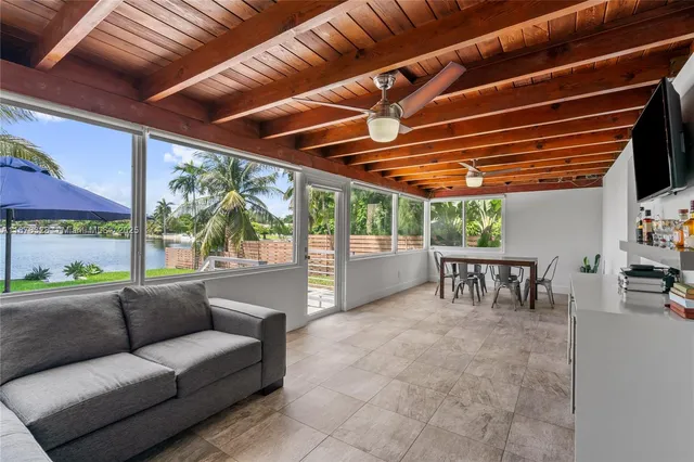 a roof deck with a table and chairs
