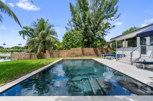 a view of a swimming pool with a patio
