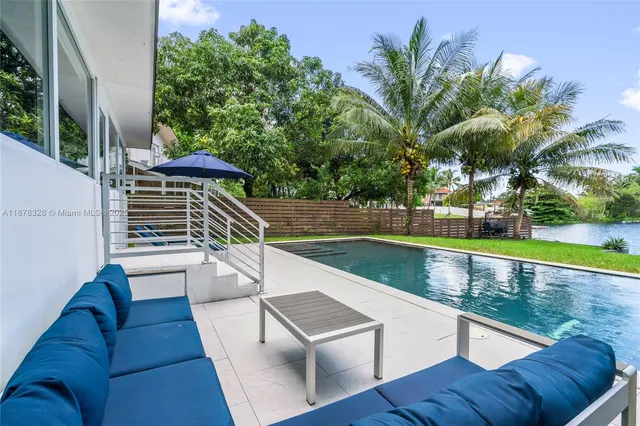 swimming pool with outdoor seating