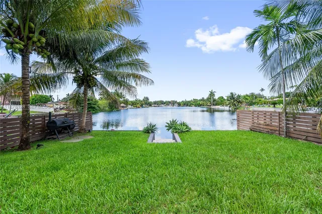 a garden with palm trees