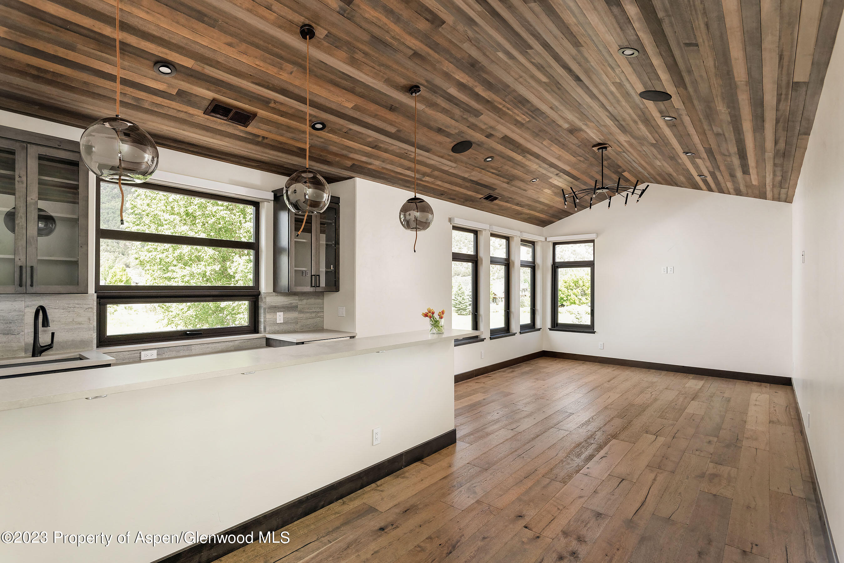 151 Sundance Trail Carbondale, CO 81623 - Photo 11 of 22 a view of a room with wooden floor and windows