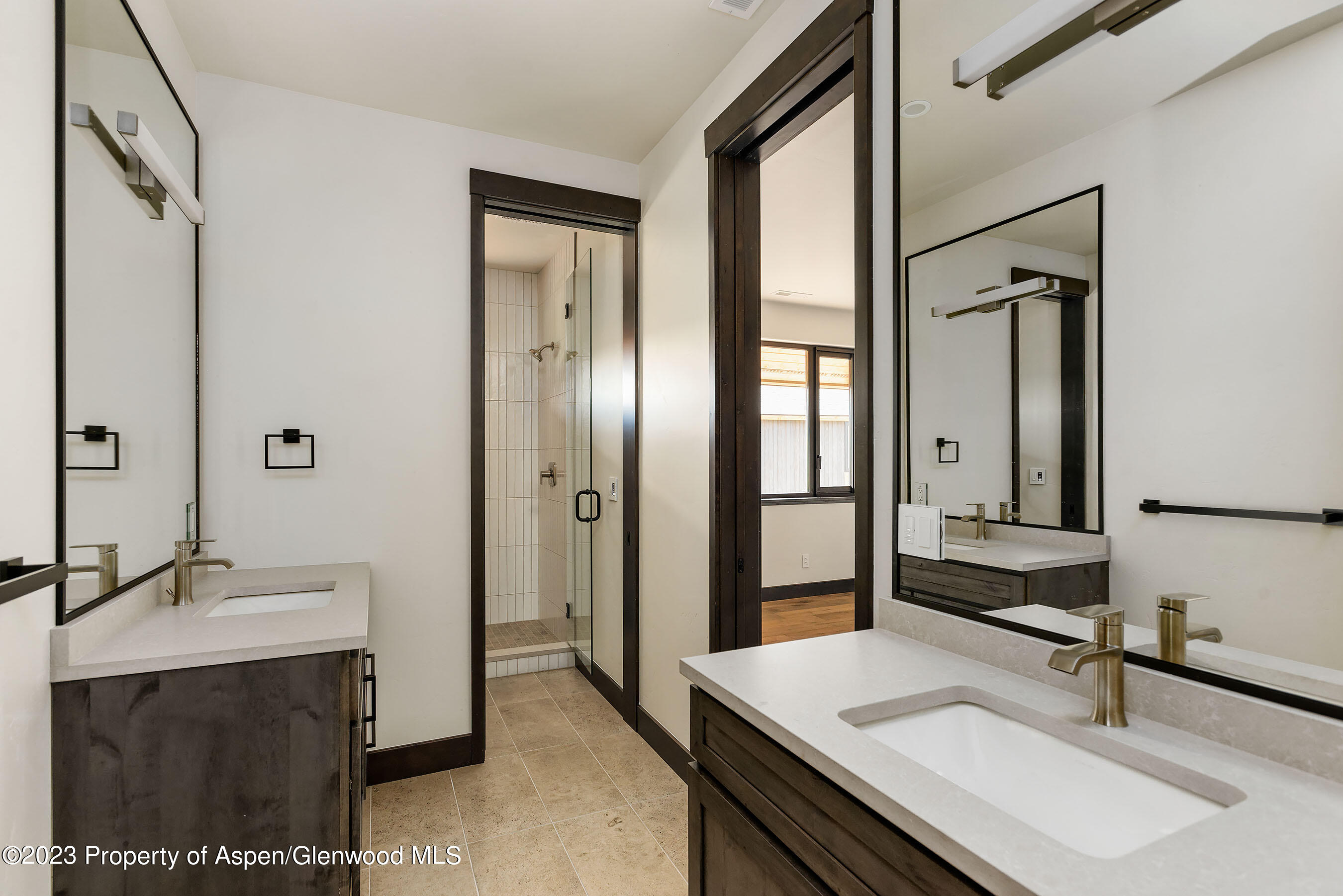 151 Sundance Trail Carbondale, CO 81623 - Photo 12 of 22 a bathroom with a sink double vanity and a mirror