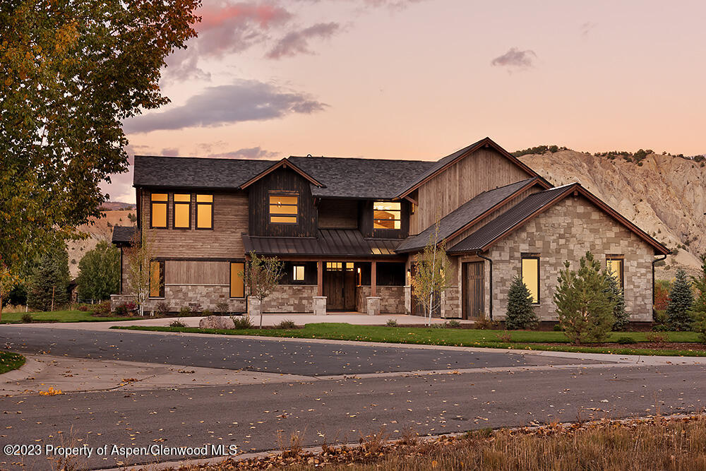 151 Sundance Trail Carbondale, CO 81623 - Photo 18 of 22 a front view of a house with a garden