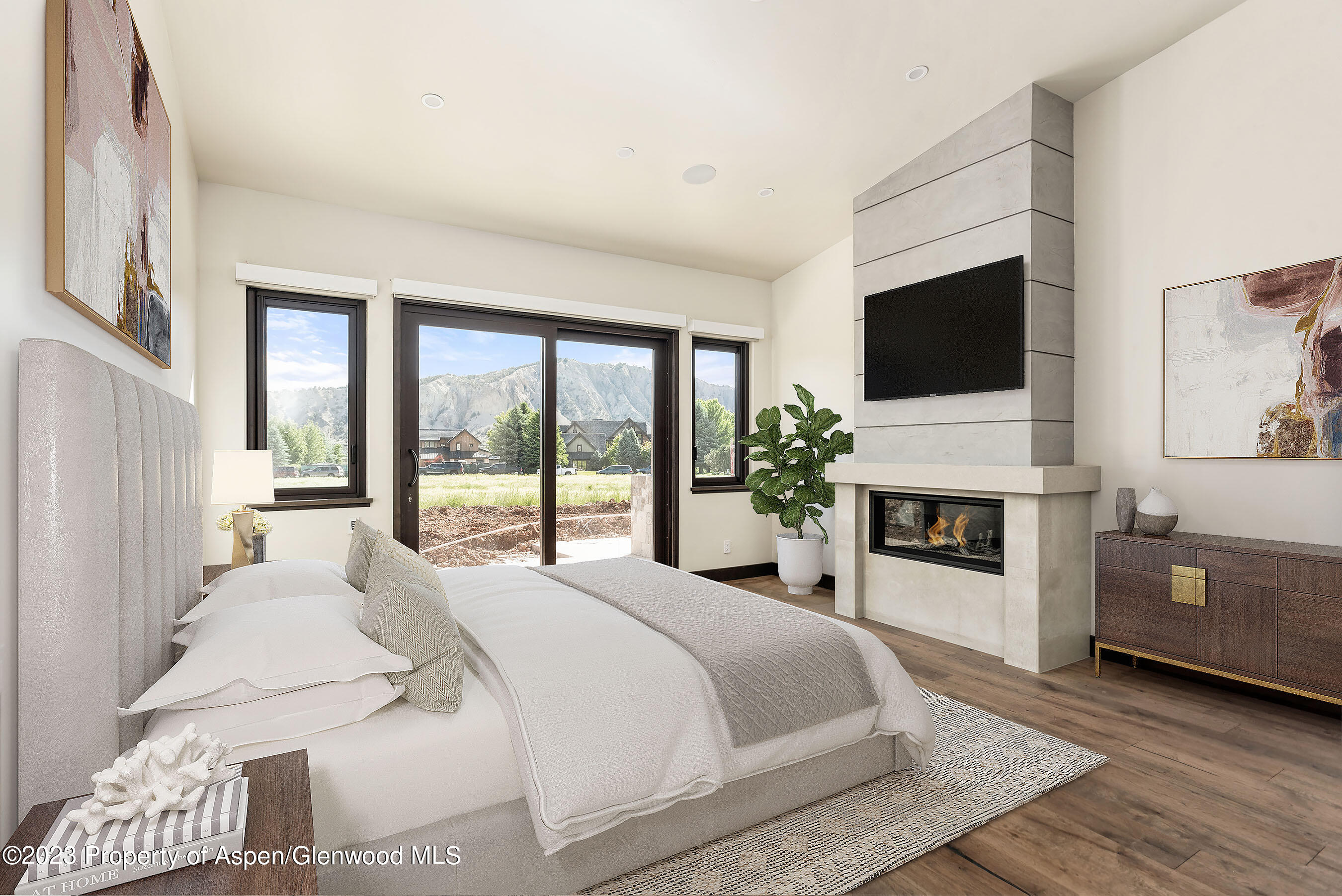 151 Sundance Trail Carbondale, CO 81623 - Photo 7 of 22 a bedroom with a bed and a flat screen tv