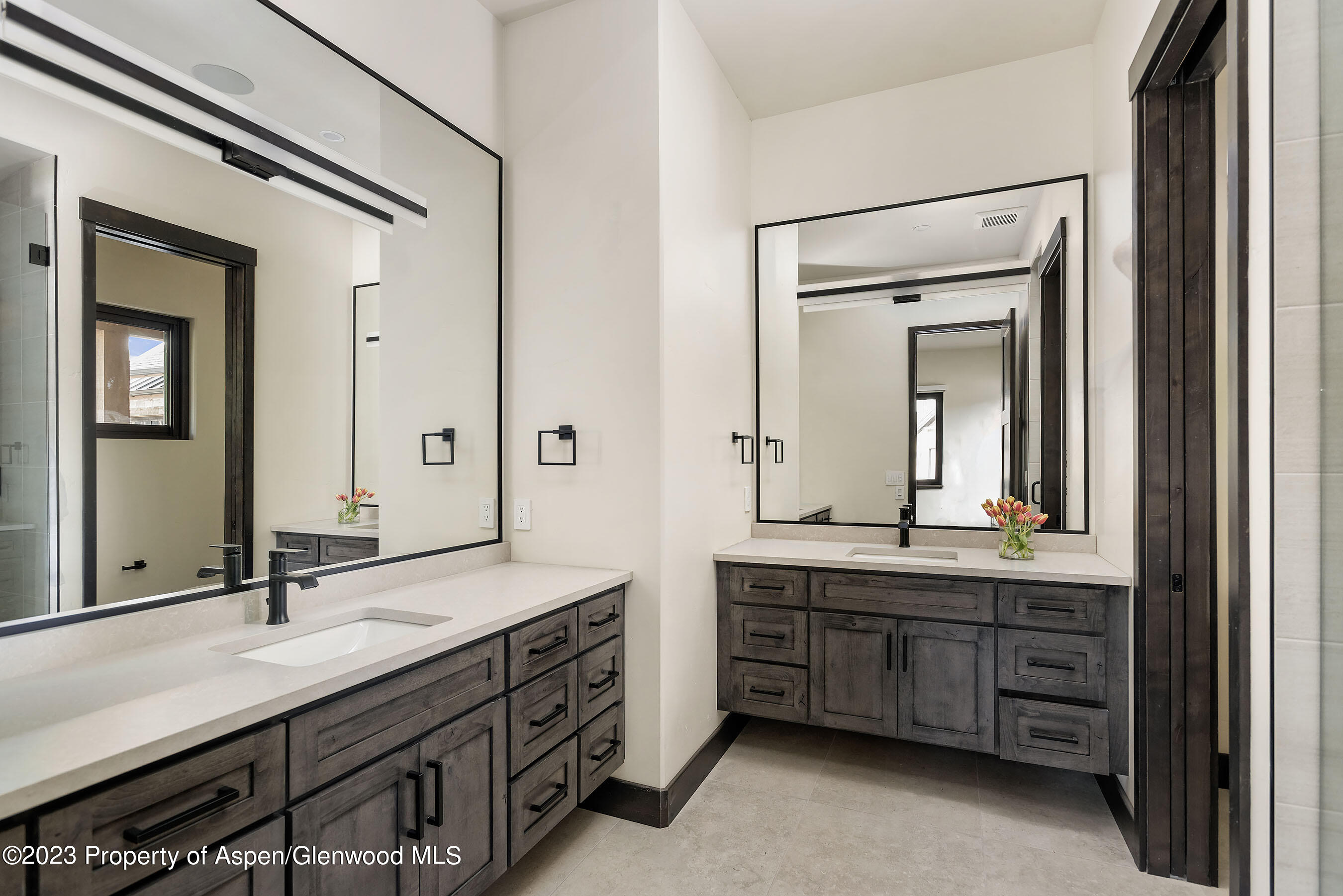 151 Sundance Trail Carbondale, CO 81623 - Photo 10 of 22 a bathroom with a double vanity sink and a mirror