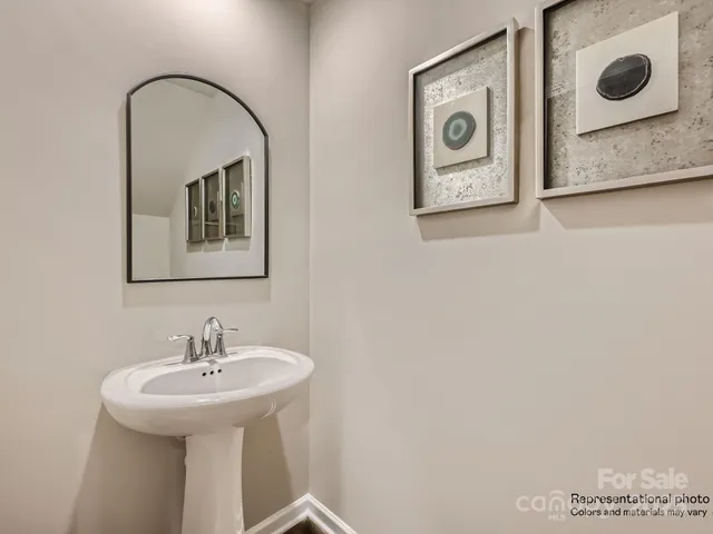 a bathroom with a sink and mirror