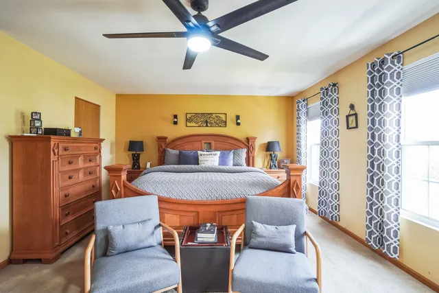 a bedroom with furniture and wooden floor