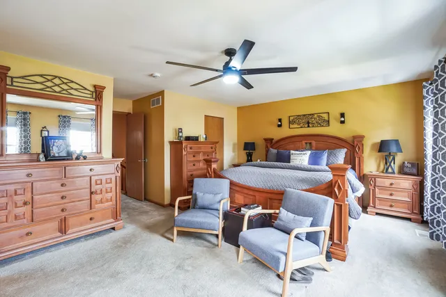 a bedroom with furniture and window