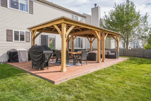 a view of a house with a backyard and a slide