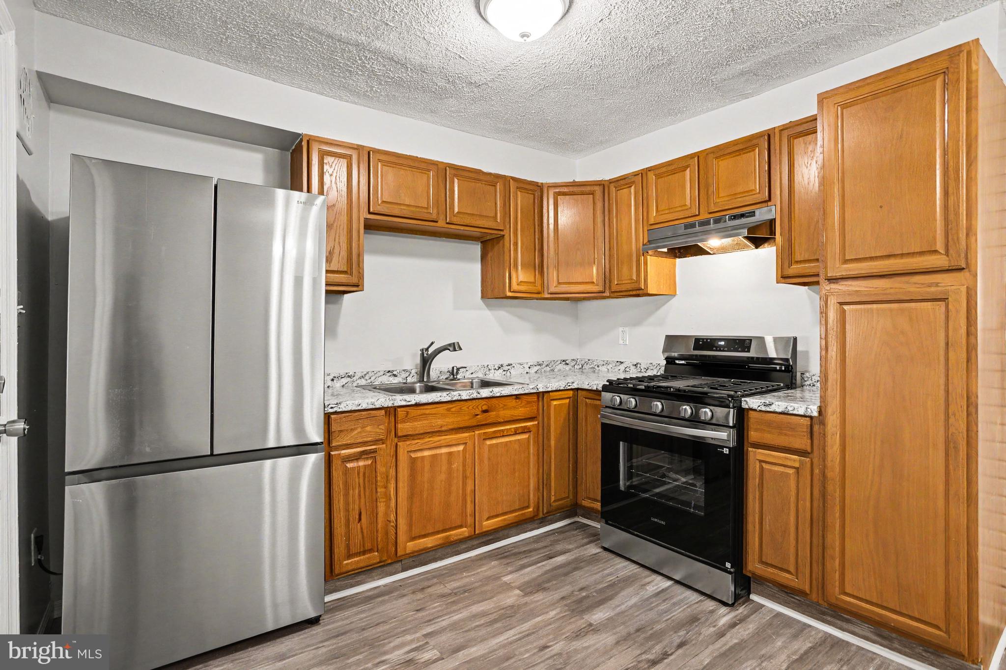 127 Bladen Road Baltimore, MD 21221 - Photo 9 of 31 New refrigerator and stove