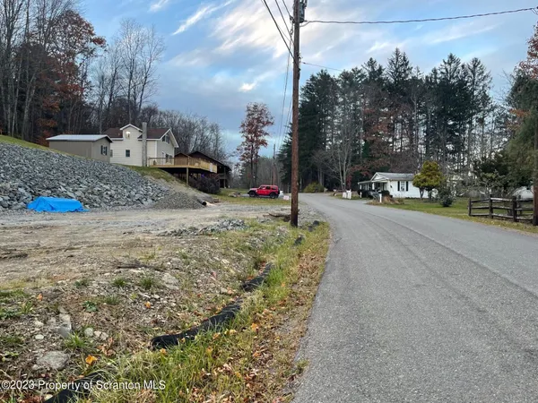 a view of a street with a building in the background