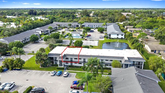 an aerial view of a house with a garden