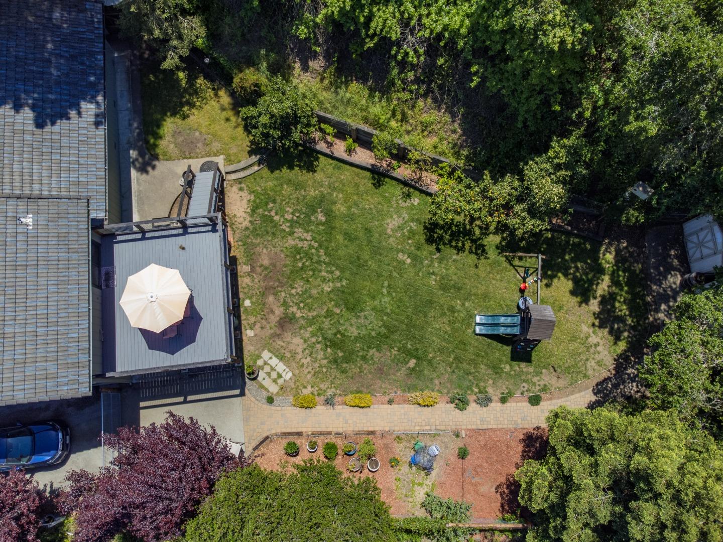 577 Carr Avenue Aromas, CA 95004 - Photo 19 of 37 a view of a back yard of the house along with trees