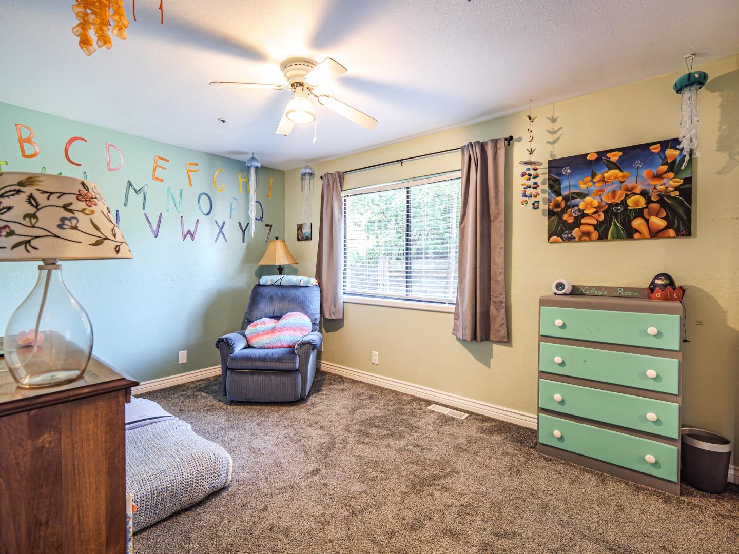 577 Carr Avenue Aromas, CA 95004 - Photo 24 of 37 a bedroom with furniture and a window