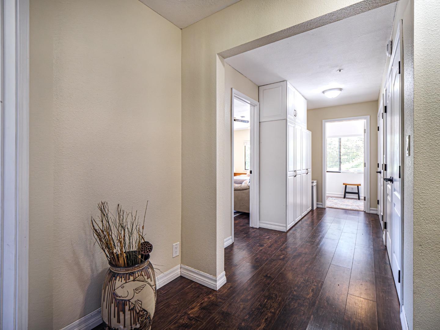 577 Carr Avenue Aromas, CA 95004 - Photo 26 of 37 a view of a hallway with wooden floor and a bathroom