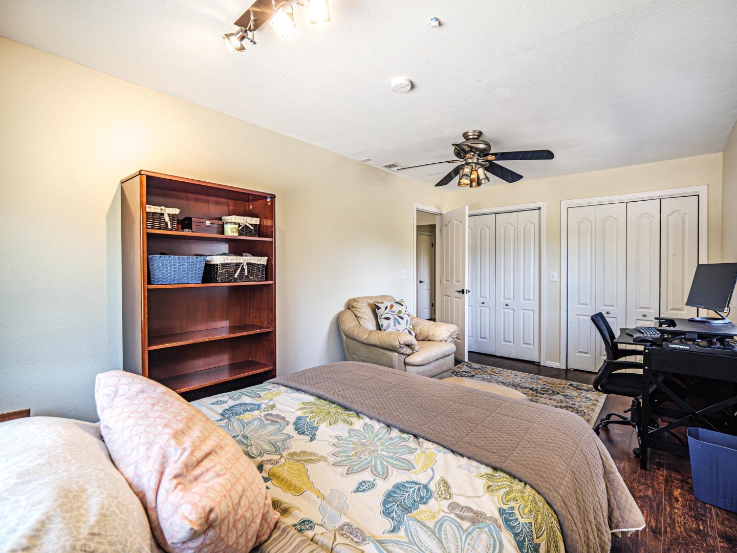 577 Carr Avenue Aromas, CA 95004 - Photo 29 of 37 a bedroom with a bed and a chair