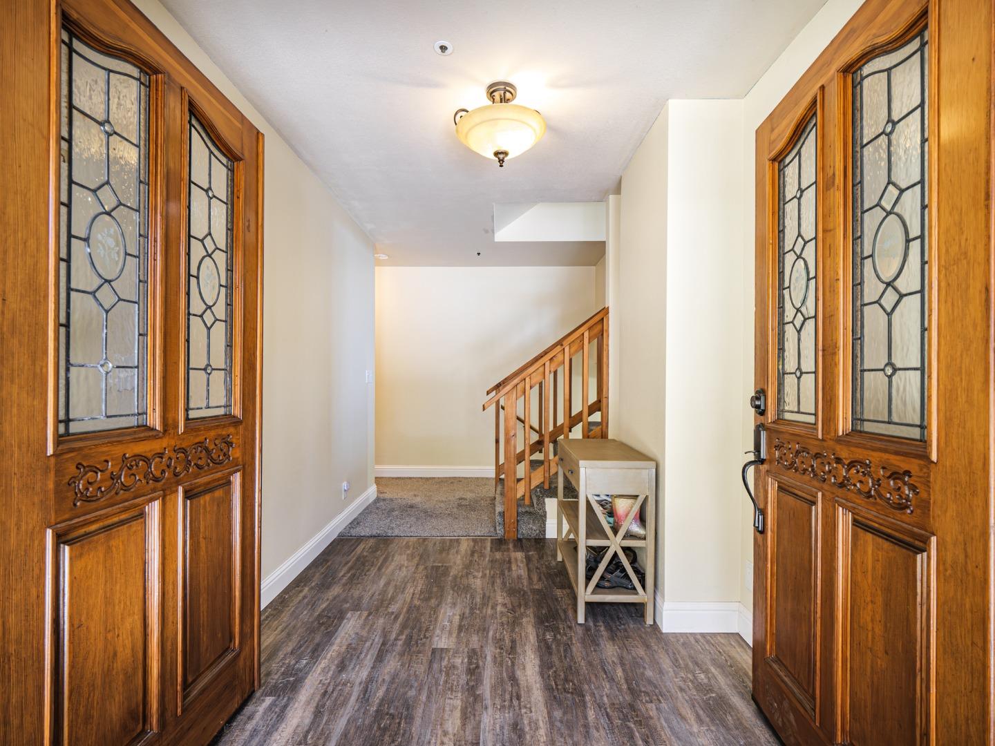 577 Carr Avenue Aromas, CA 95004 - Photo 5 of 37 a view of a hallway with wooden floor and staircase