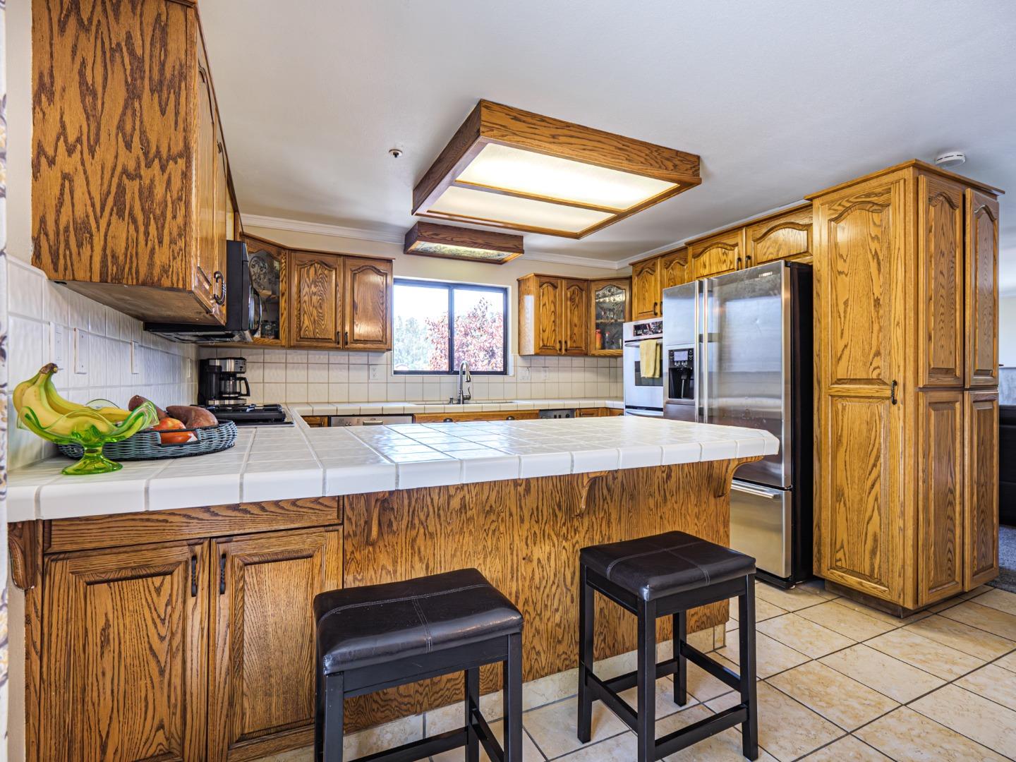 577 Carr Avenue Aromas, CA 95004 - Photo 6 of 37 a kitchen with a sink appliances and cabinets