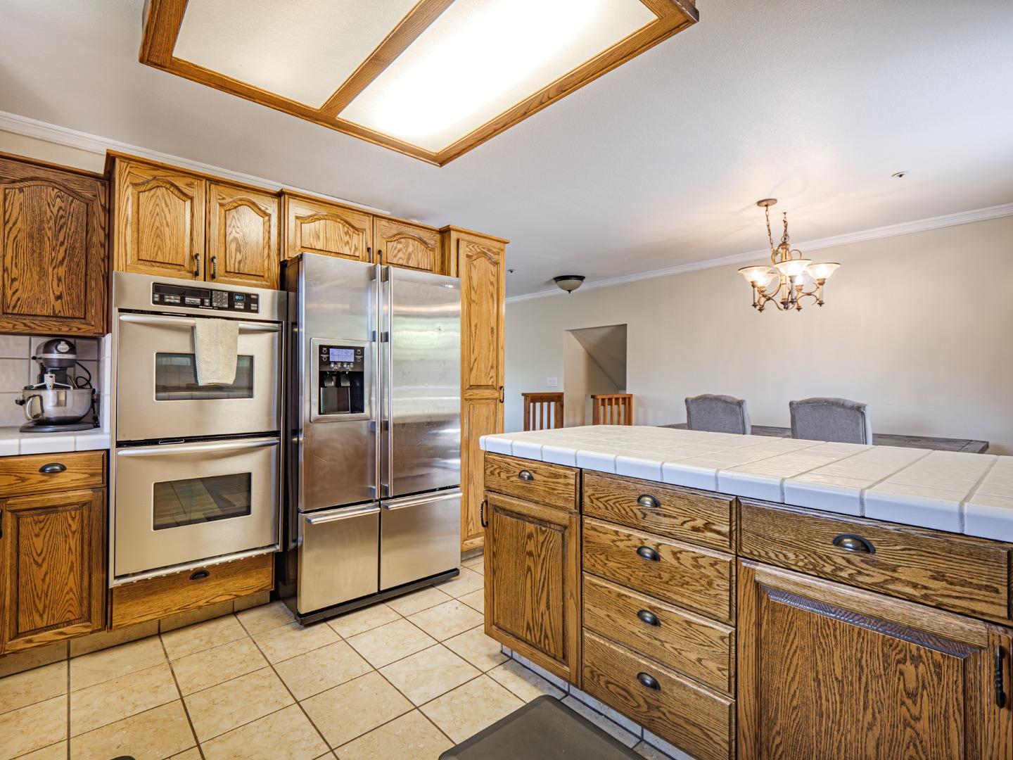 577 Carr Avenue Aromas, CA 95004 - Photo 7 of 37 a kitchen with cabinets and stainless steel appliances