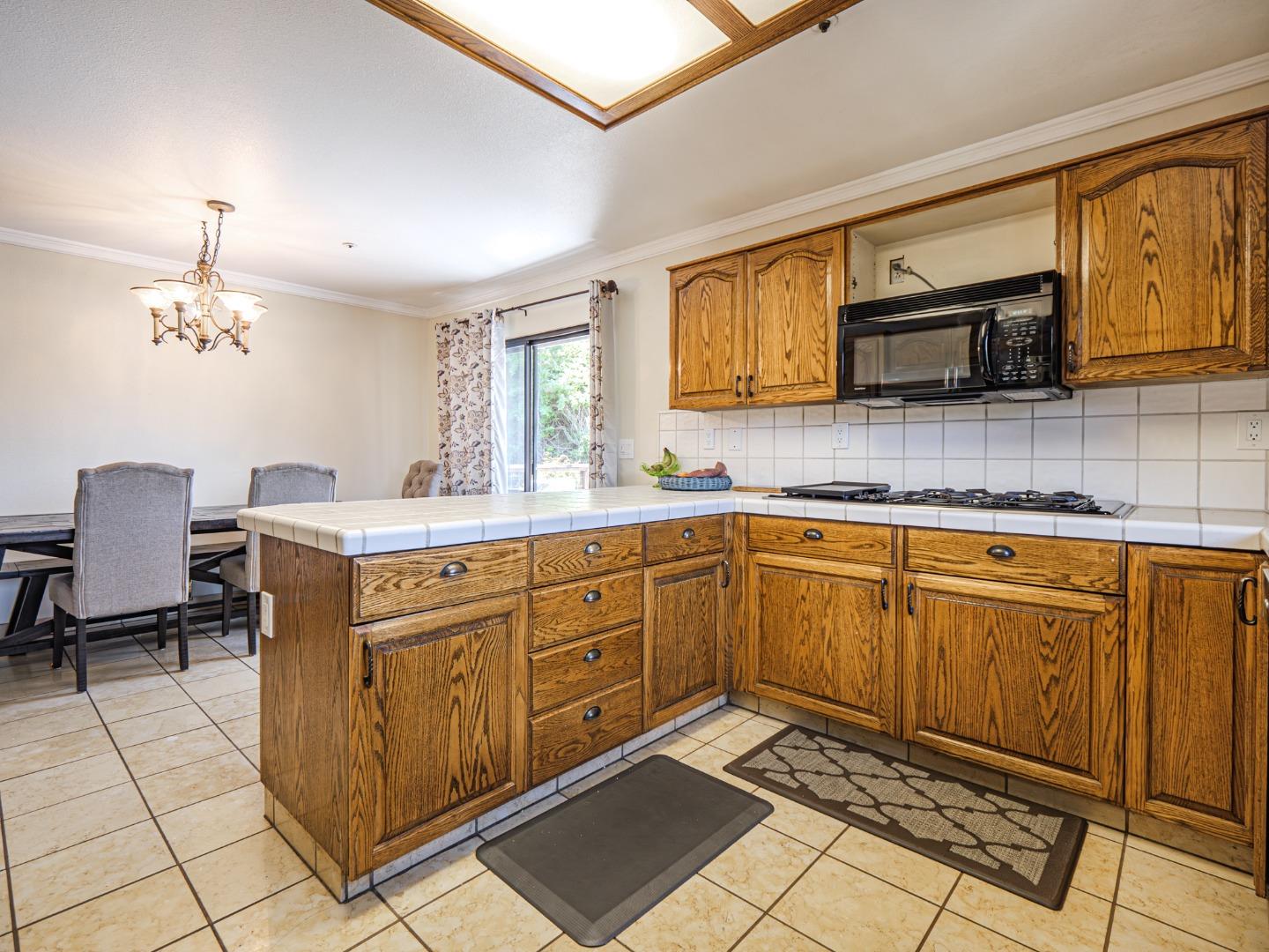 577 Carr Avenue Aromas, CA 95004 - Photo 8 of 37 a kitchen with cabinets a sink and appliances