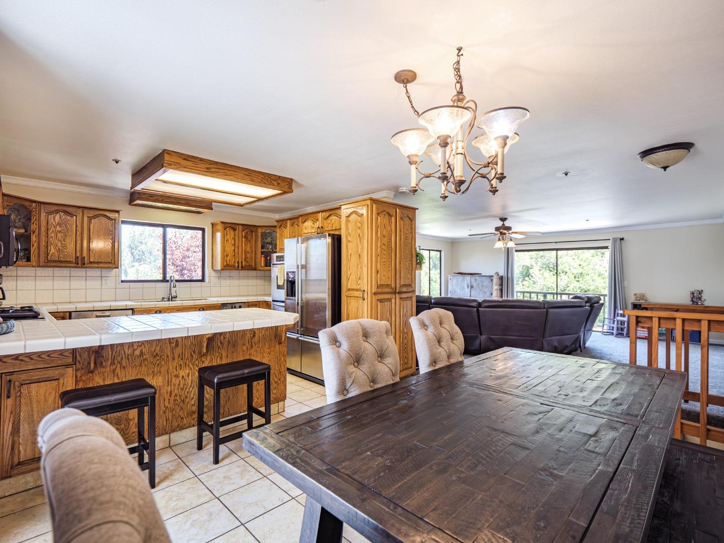 577 Carr Avenue Aromas, CA 95004 - Photo 9 of 37 a view of a dining room with furniture and chandelier