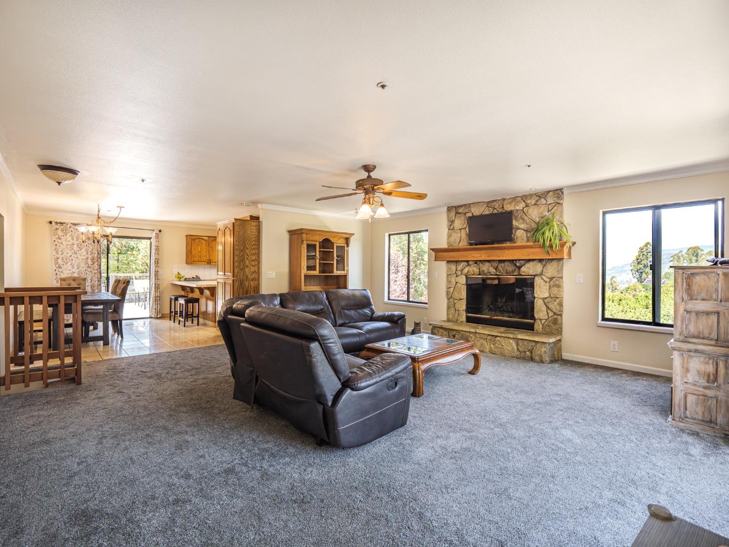 577 Carr Avenue Aromas, CA 95004 - Photo 10 of 37 a living room with furniture a window and a fireplace