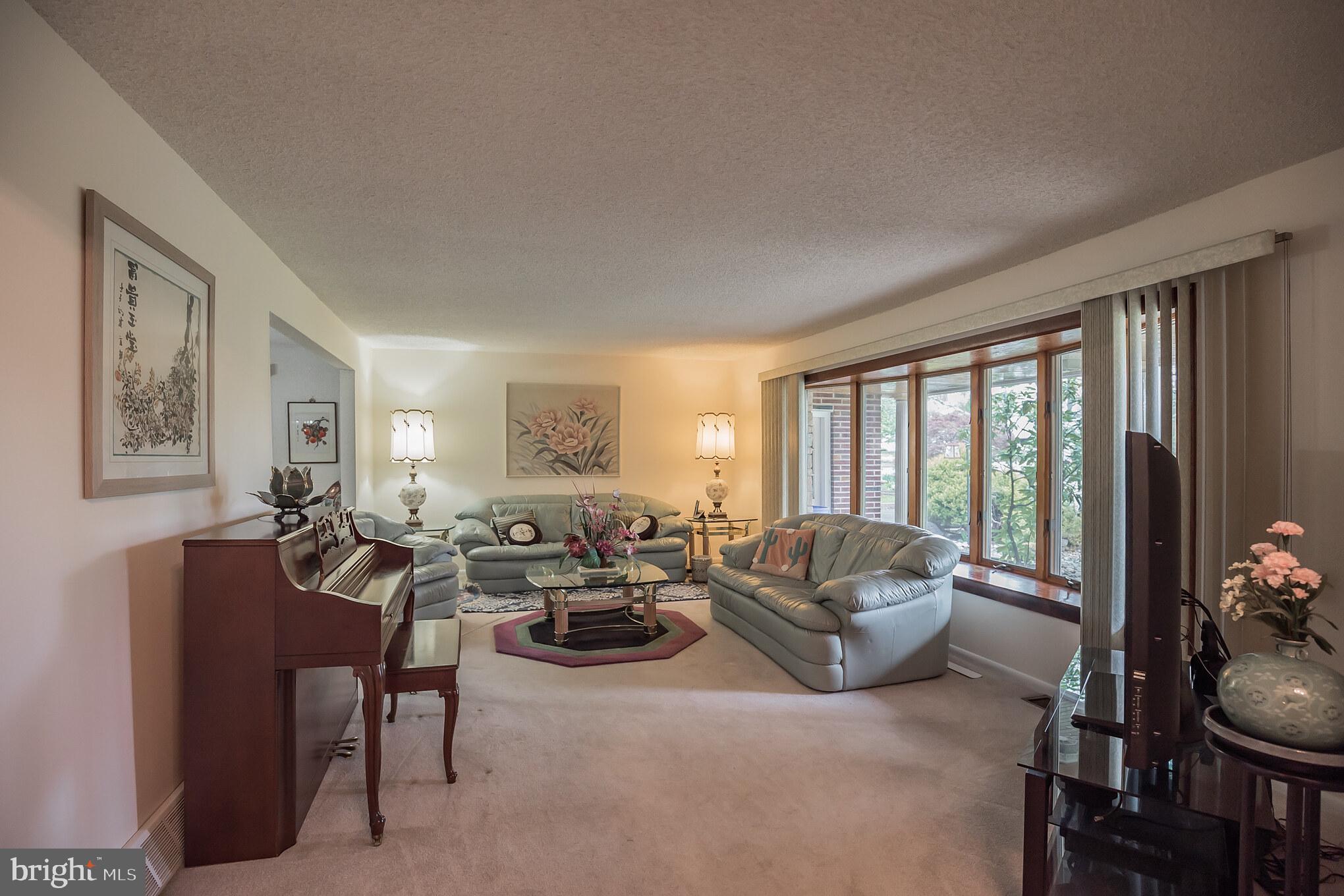 Spacious living room with bow window