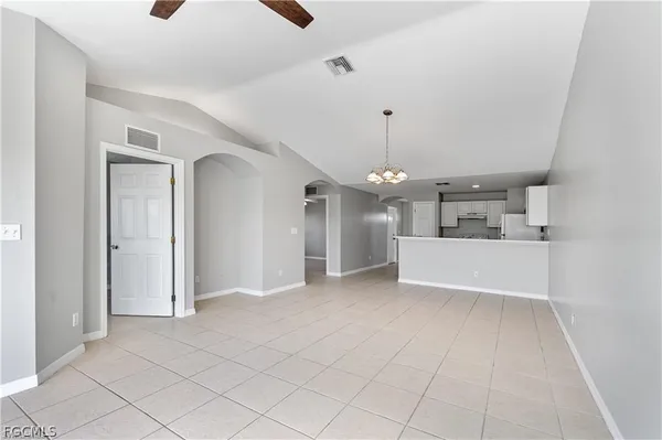 a view of kitchen with white cabinets