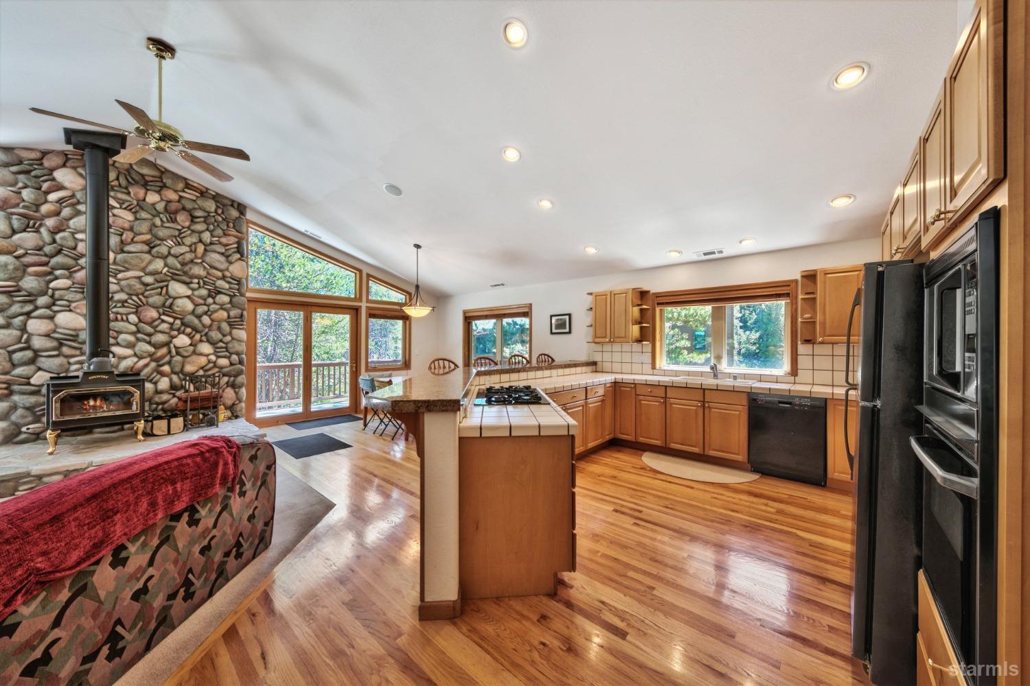 34235 Fremont Road Kirkwood, CA 95646 - Photo 11 of 29 a living room with furniture and a flat screen tv