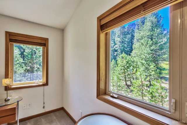 a view of room with window and furniture