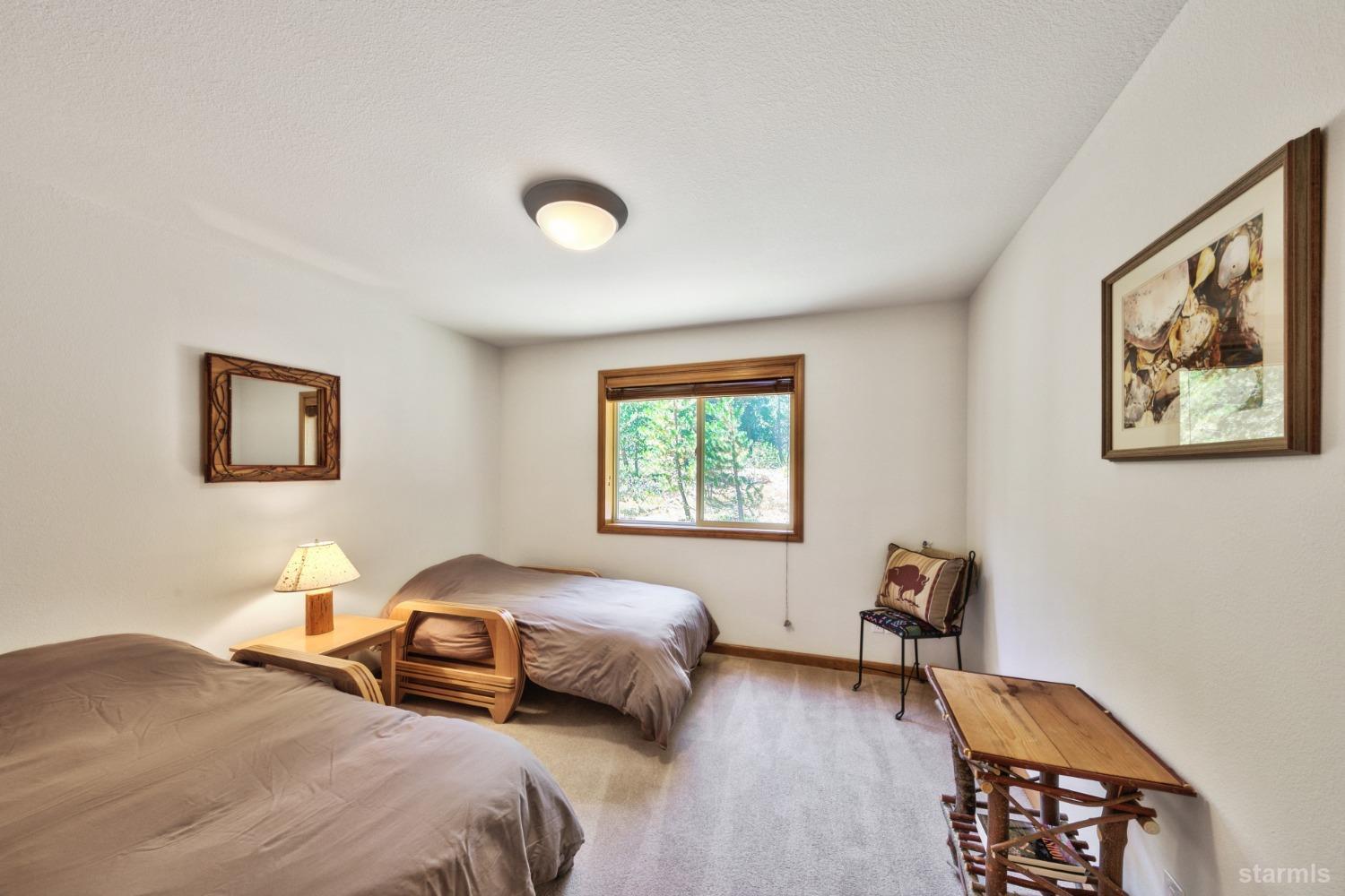 34235 Fremont Road Kirkwood, CA 95646 - Photo 17 of 29 a bedroom with a bed and a window