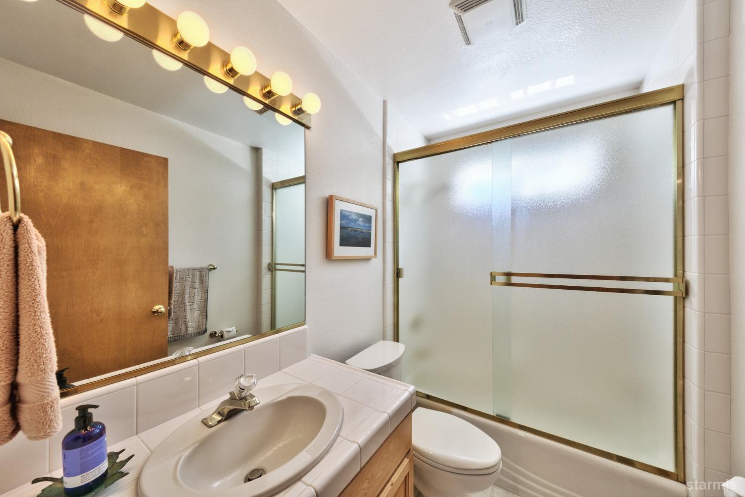 34235 Fremont Road Kirkwood, CA 95646 - Photo 18 of 29 a bathroom with a sink toilet and shower