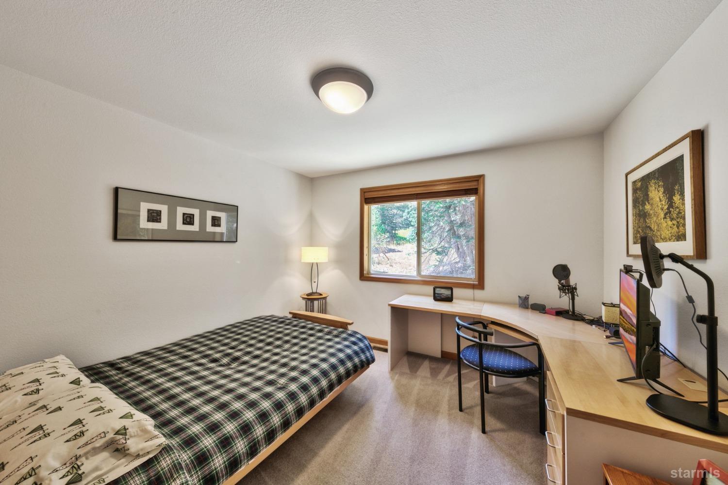 34235 Fremont Road Kirkwood, CA 95646 - Photo 19 of 29 a bedroom with a bed and a table in it